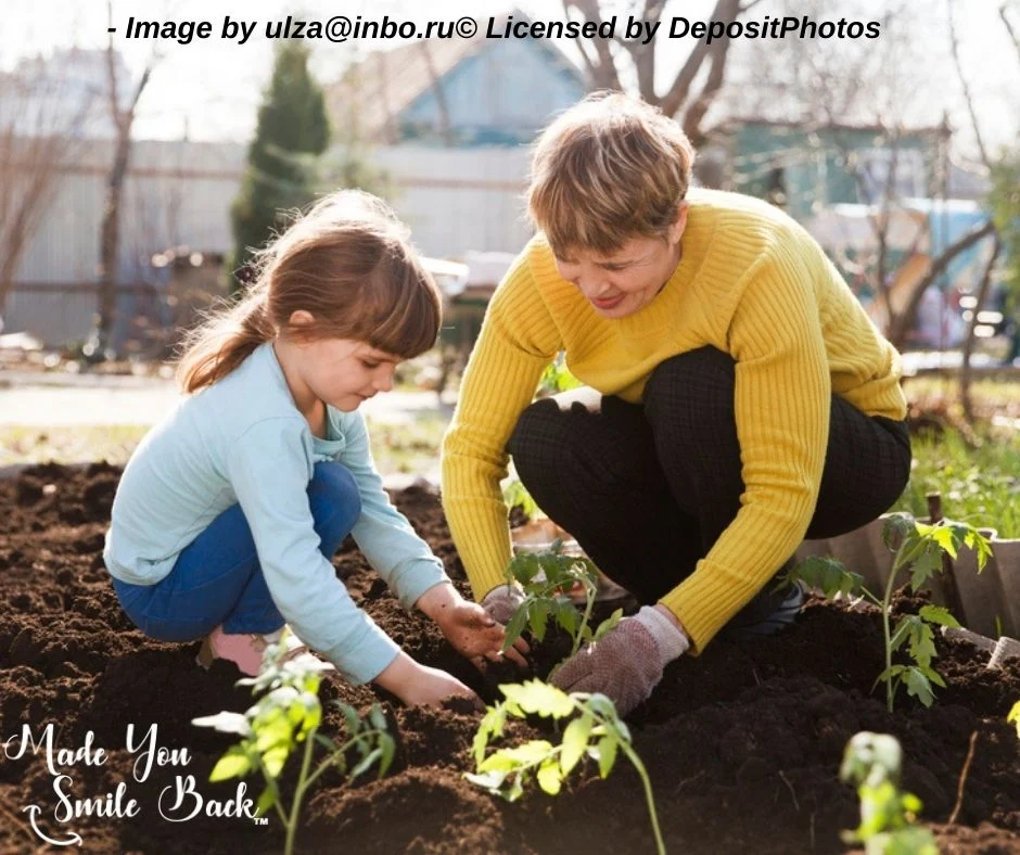 Photo showing granddaughter helping in the garden with her grandma.